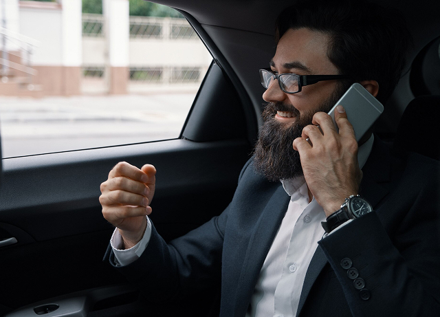 Executive on the phone during a corporate transfer in Barcelona