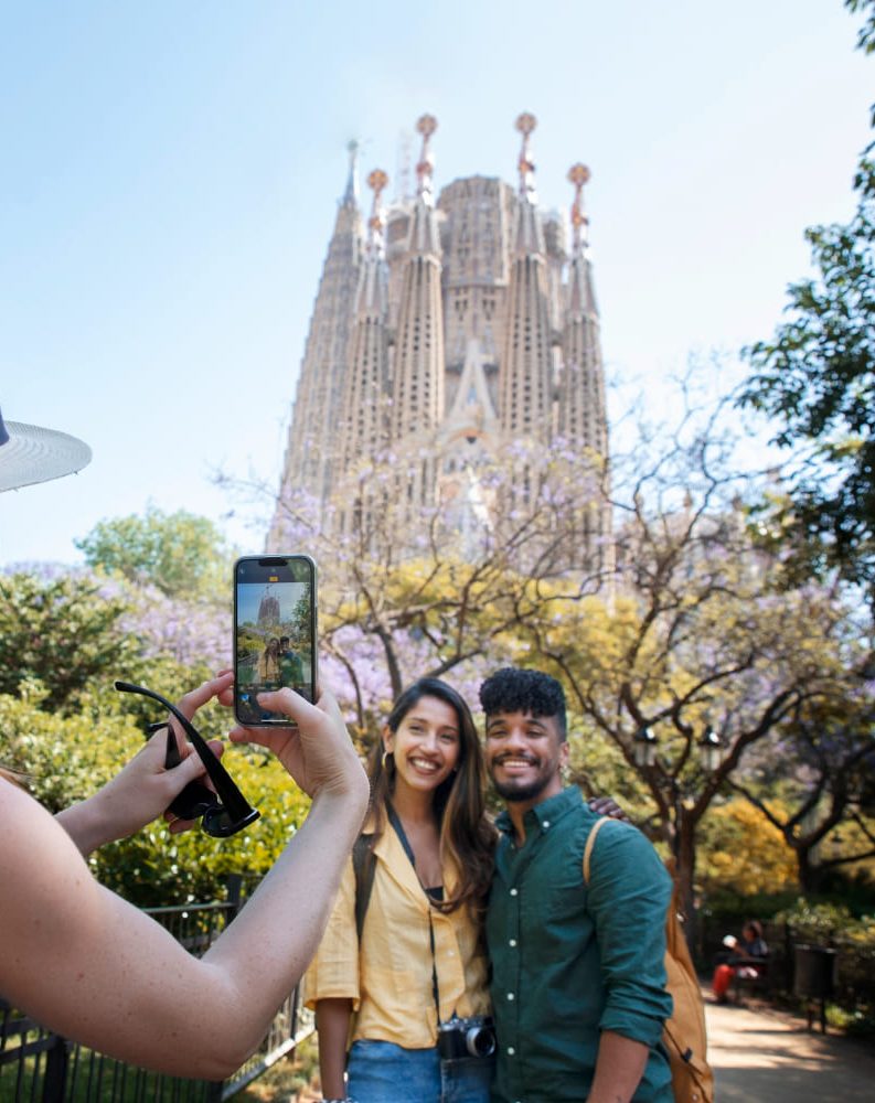 Tourists photographing the Sagrada Família during a private tour in Barcelona